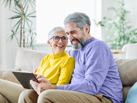 Smiling couple on couch