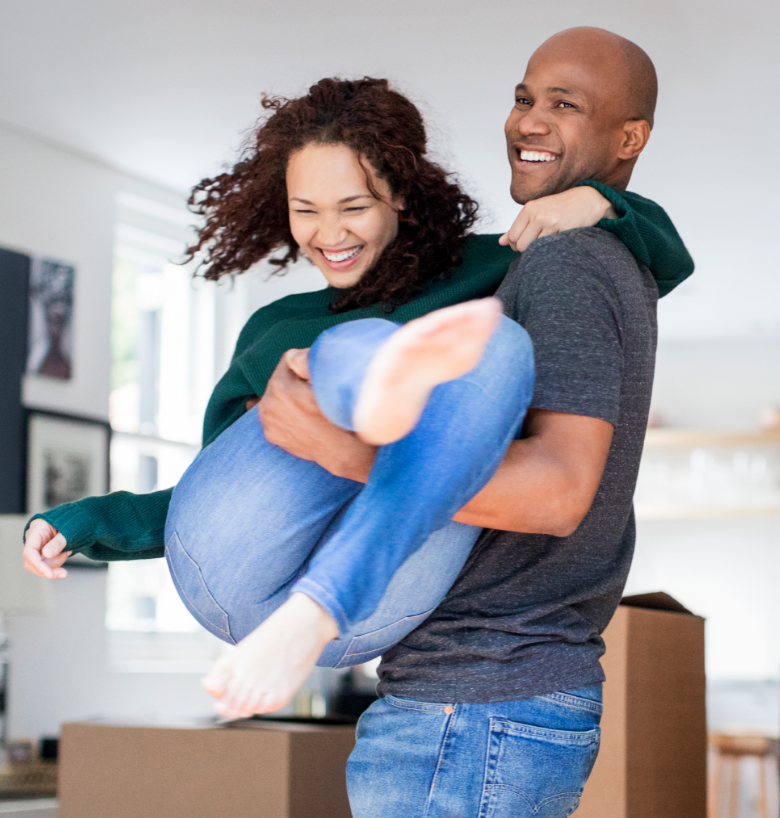 Laughing couple in home