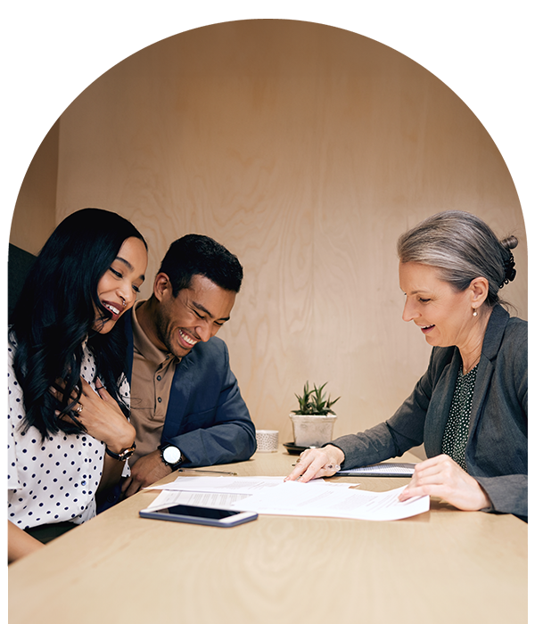 Smiling couple working with Loan Officer